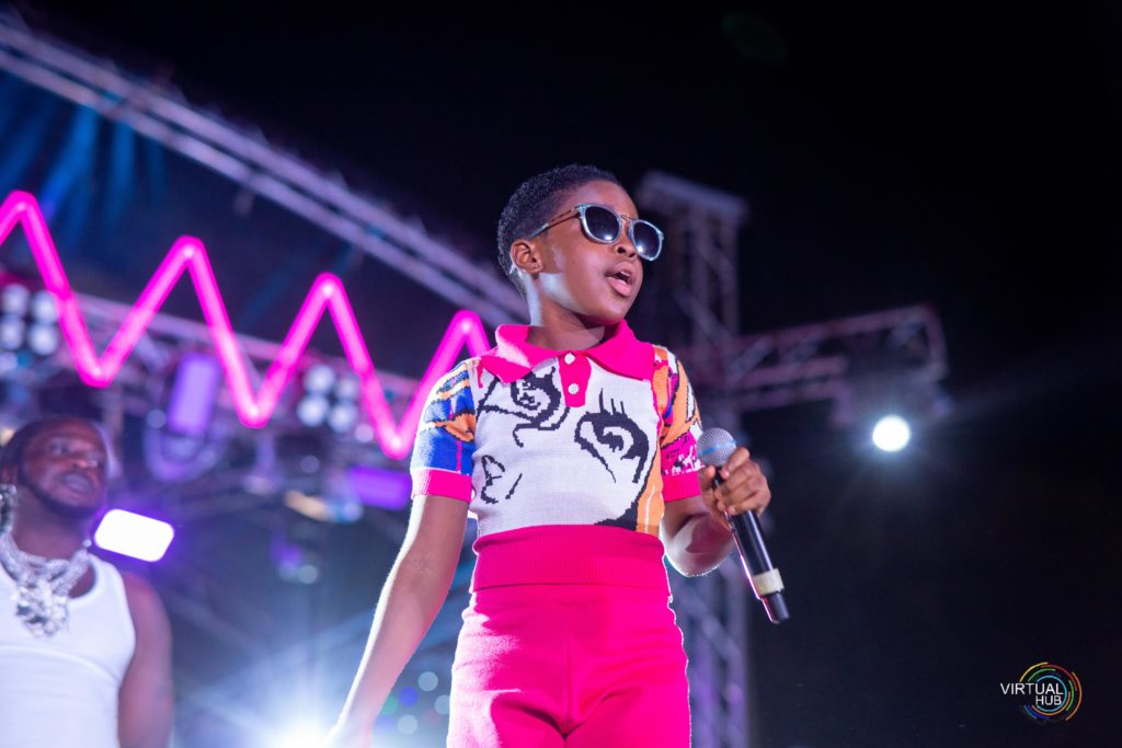 A young girl performing on a stage